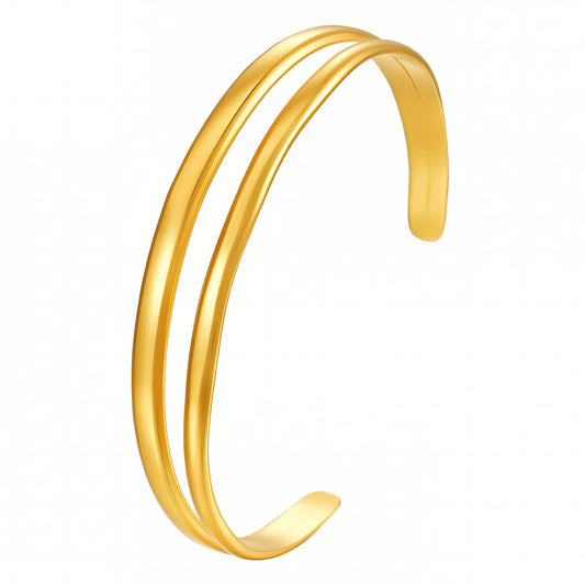 Gold bangle on a white background