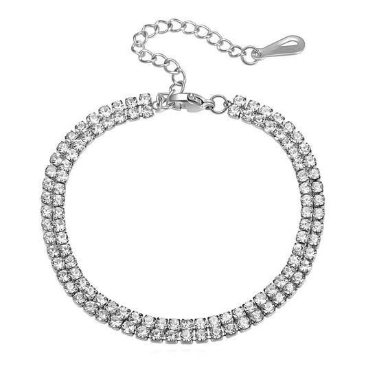 Silver bracelet with clear gemstones on a white background